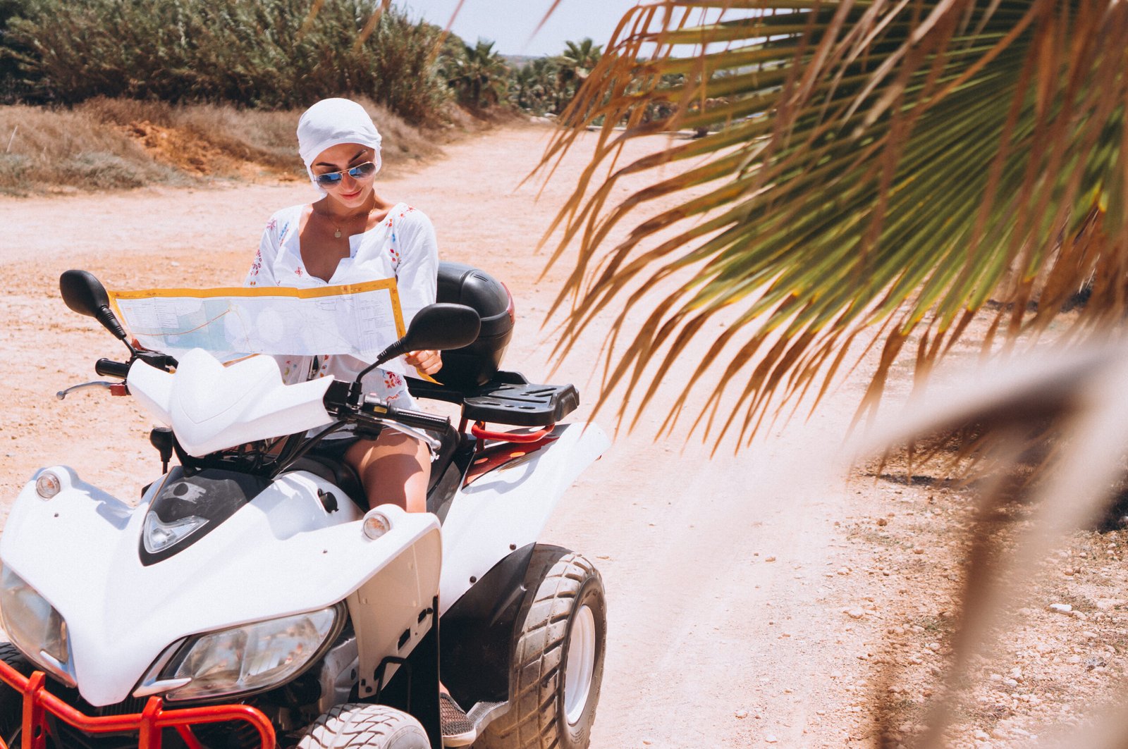 Woman travelling on quad with map